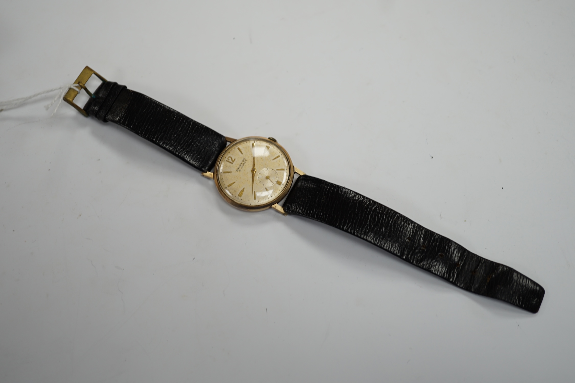 A gentleman's Swiss 9ct gold Griffon manual wind wrist watch, on a leather strap, case diameter 33mm.